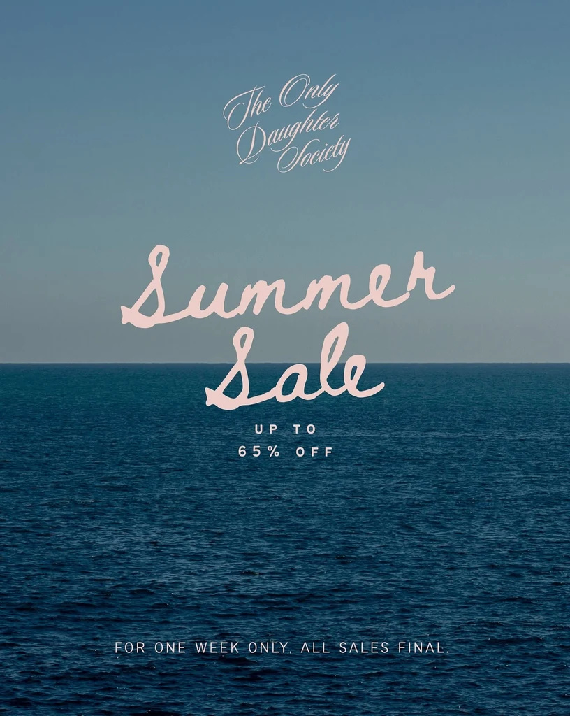 Summer Sale promo over a calm blue sea: a pink script ‘Summer Sale’ headline, ‘Up to 65% off’, The Only Daughter Society wordmark at the top, and a small caption at the bottom reading ‘For one week only. All sales final.’
